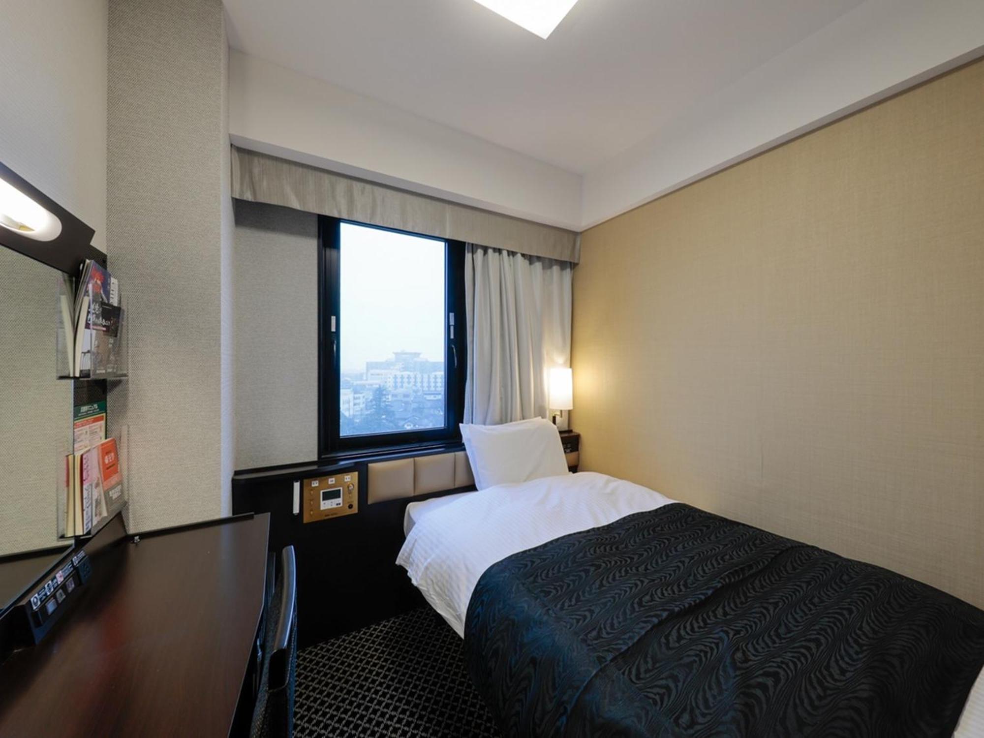 Apa Hotel Tonami Ekimae Kültér fotó